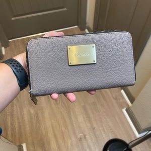 Gray Calvin Klein zip around wallet